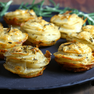 A plate of food, with Asiago Potato Stacks