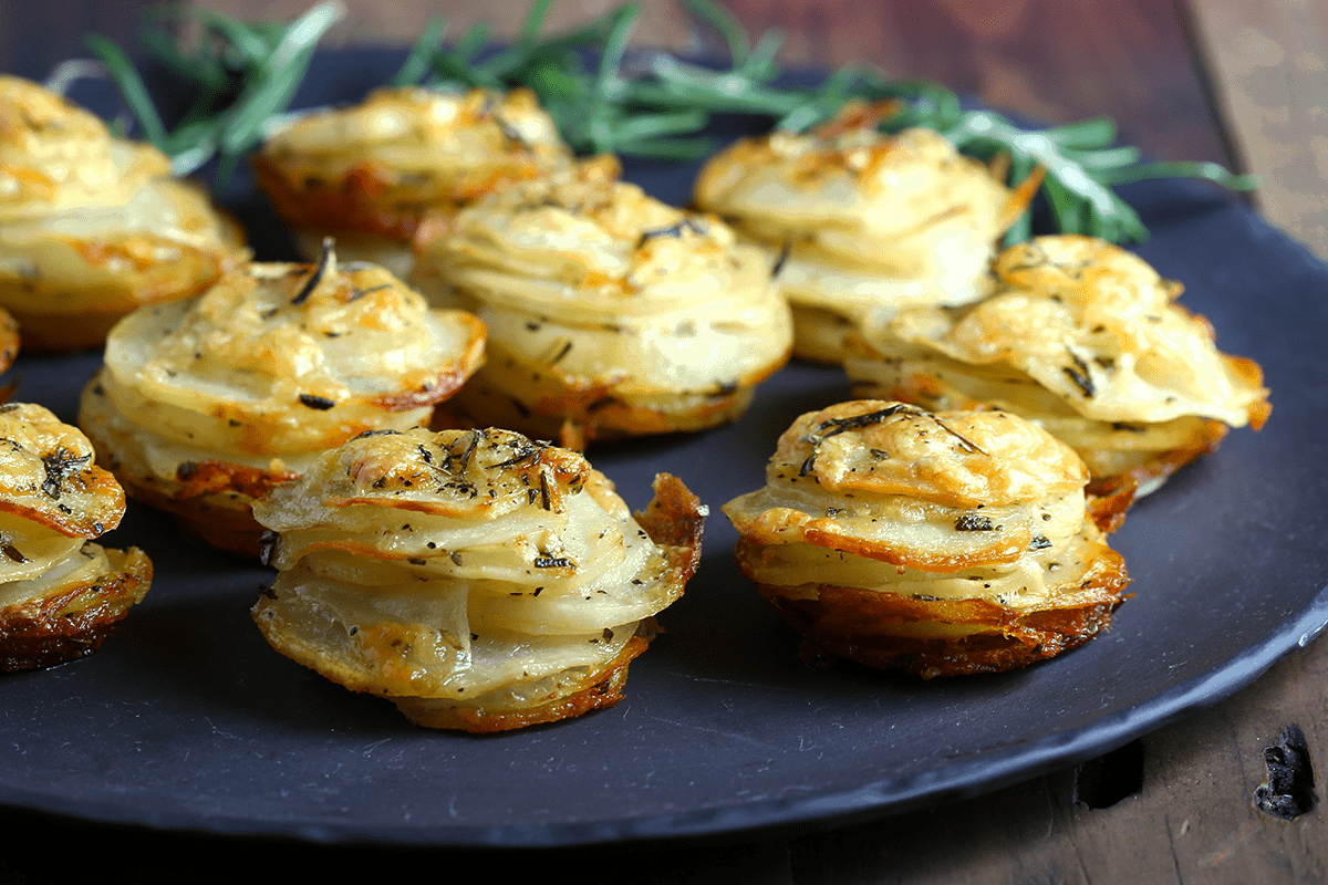 A plate of food, with Asiago Potato Stacks