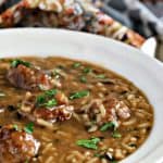 pork meatball and wild rice soup in a white bowl