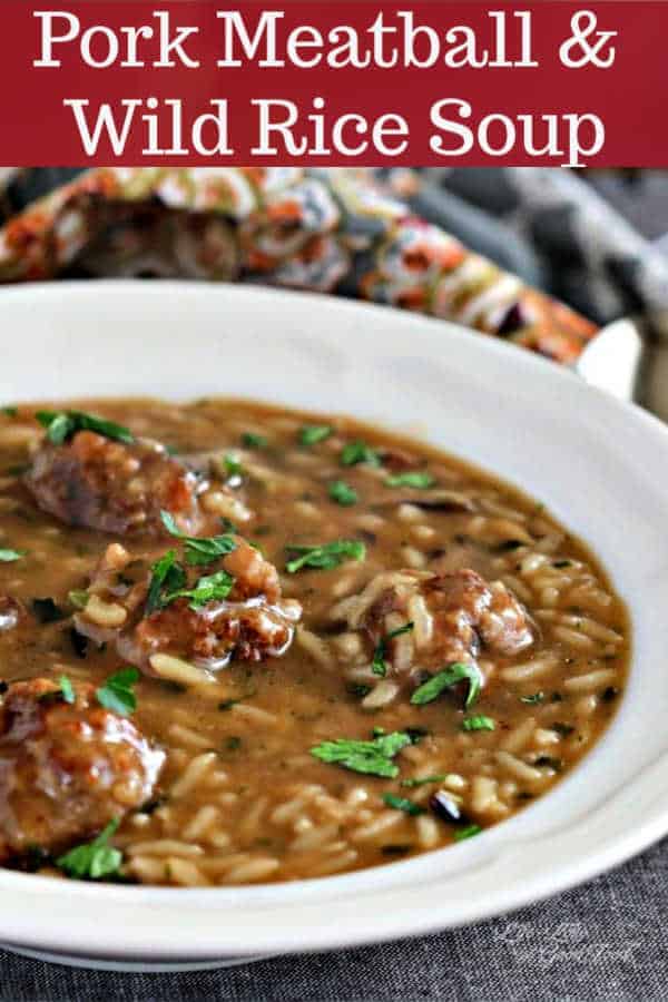 pork meatball and wild rice soup in a white bowl