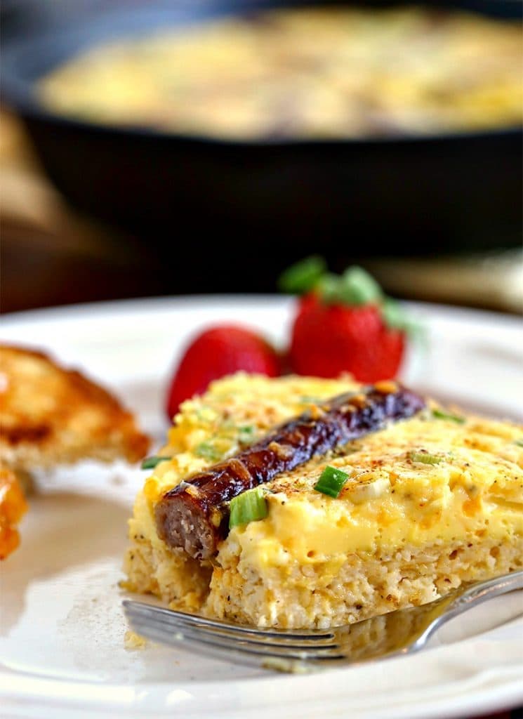 A close up of food on a plate, with Rustic Sausage and Grits Egg Skillet