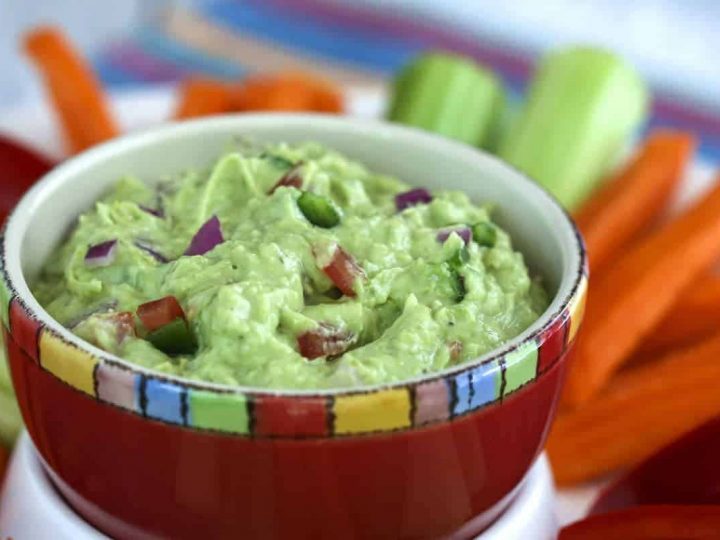 A close up of a bowl of food, with Guacamole