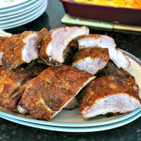 A plate of smoked pork ribs on a table