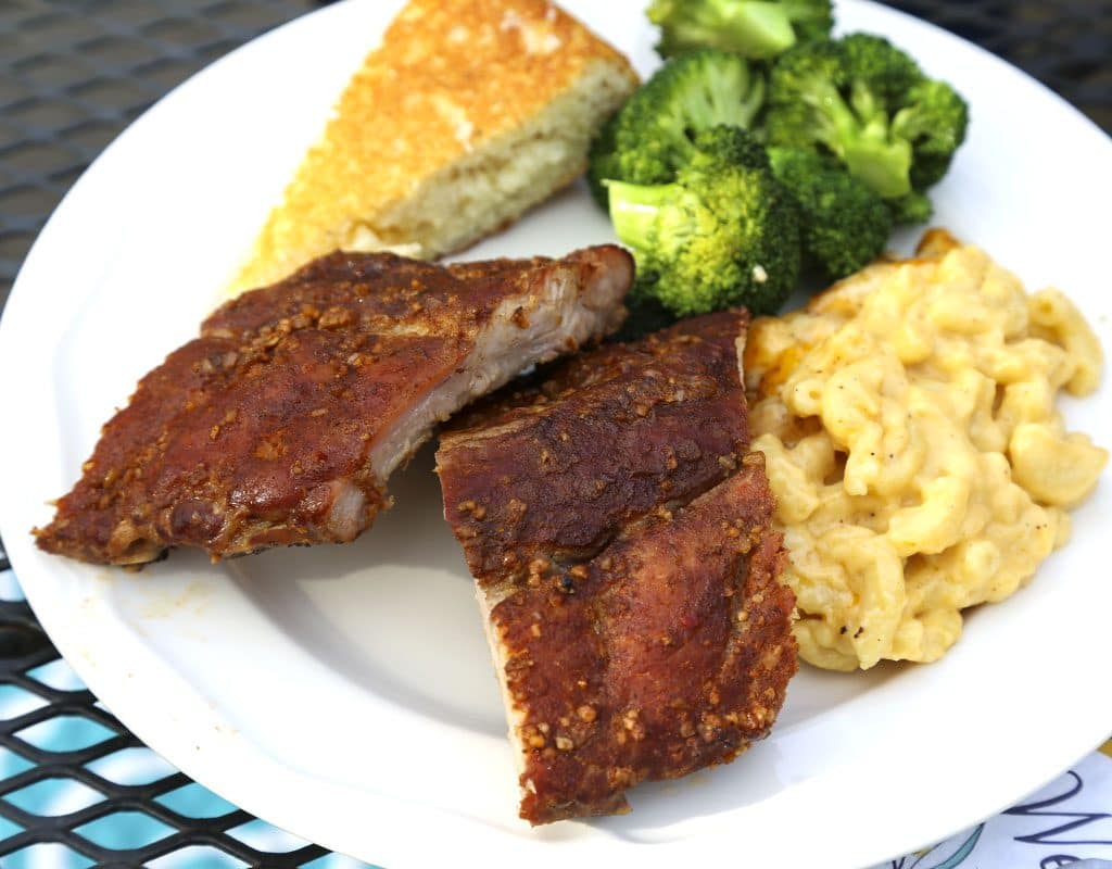 A plate of food with broccoli, macaroni and cheese, with Smoked Baby Back Ribs