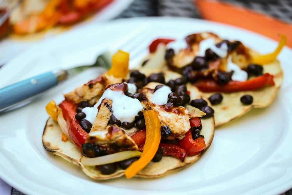 A plate of BBQ Chicken Tostadas