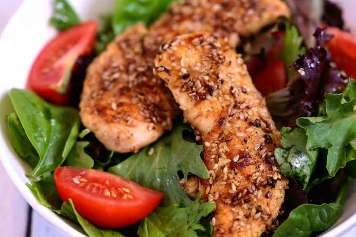 A plate of food with Sesame Chicken Salad