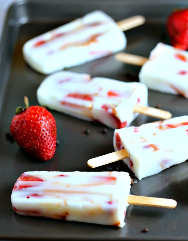 A close up of low fat strawberry vanilla yogurt pops