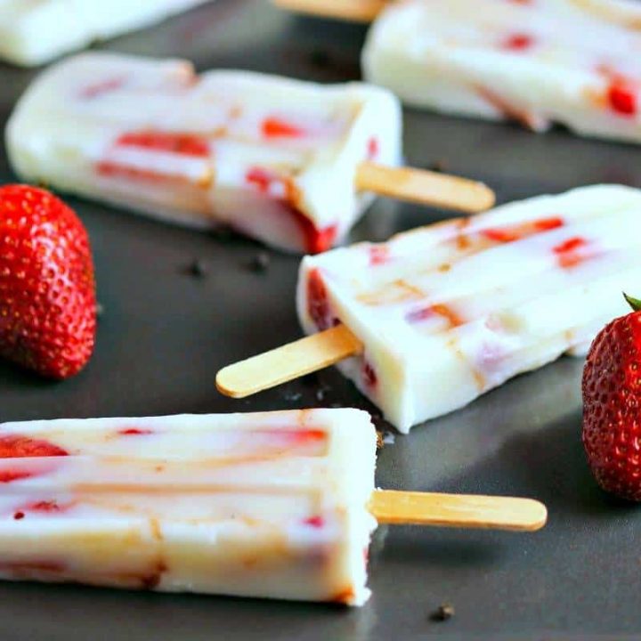 A close up of low fat strawberry vanilla yogurt pops