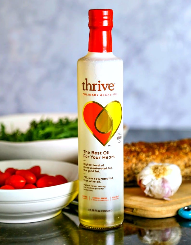 A close up of a bottle of Thrive Algae Oil