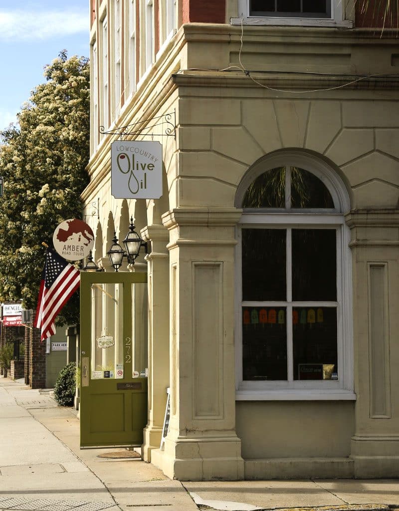 A close up of a street in front of a building in charleston