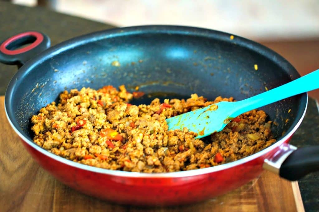 A skilled with cooked filling for BBQ Turkey Stuffed Peppers