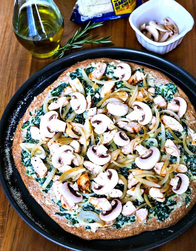 A chicken florentine pizza ready for the oven