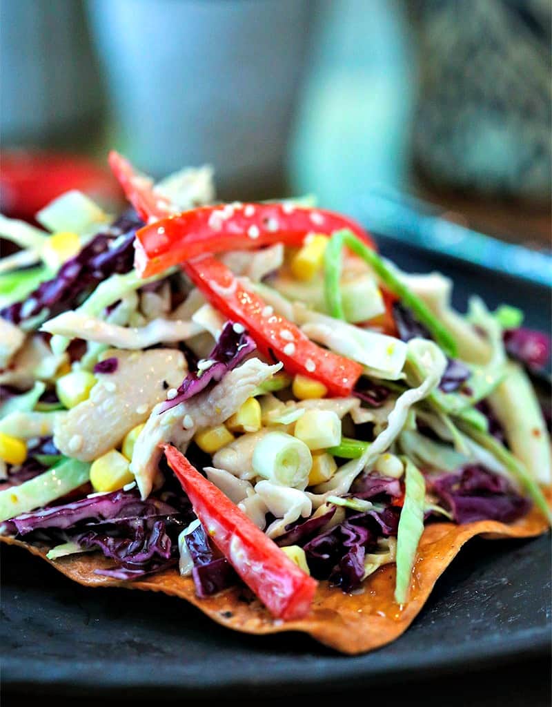 A close up of a plate of Asian Slaw with Egg Roll Crackers