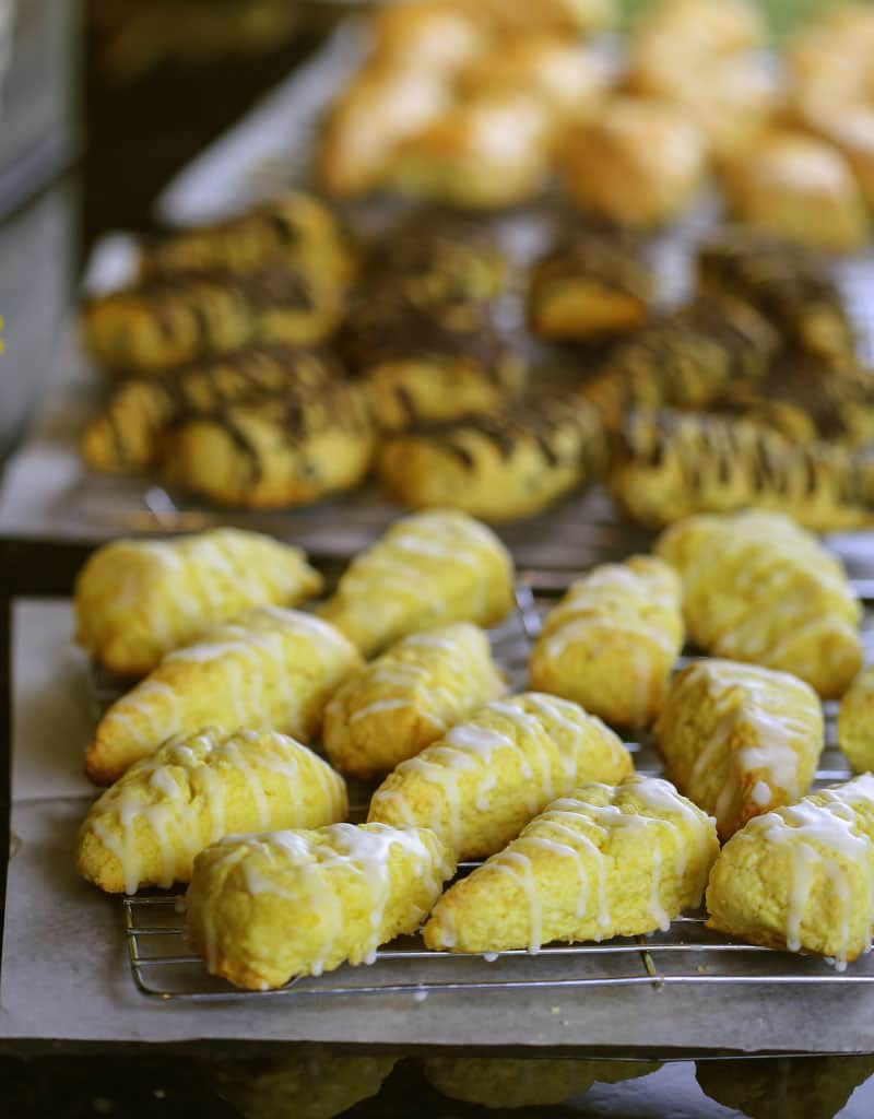 A counter filled with lots of different scones