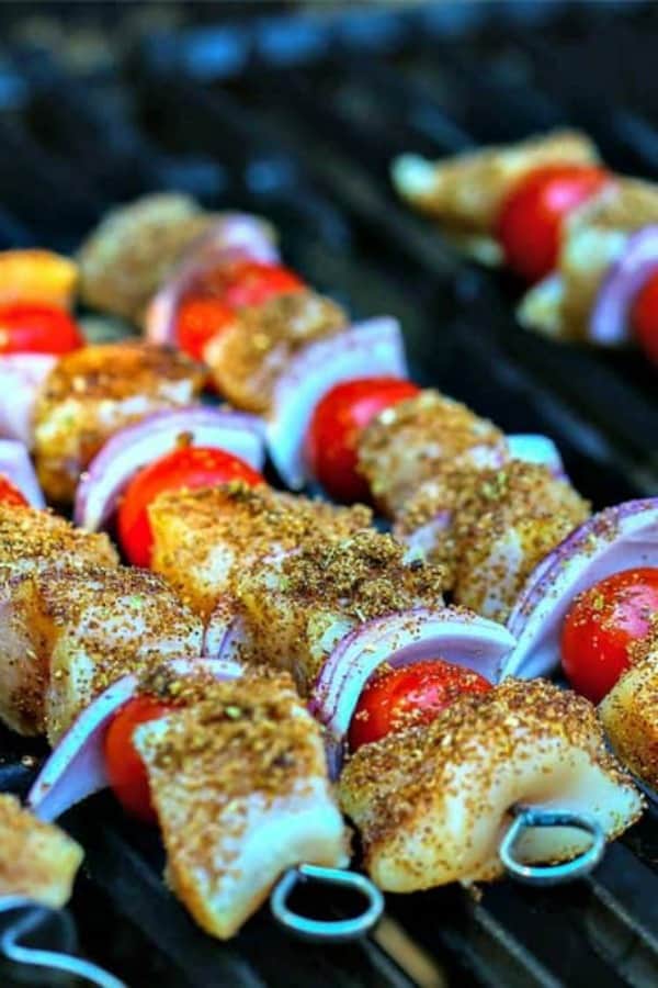A close up of uncooked Smoky Chicken Kabobs ready for the grill