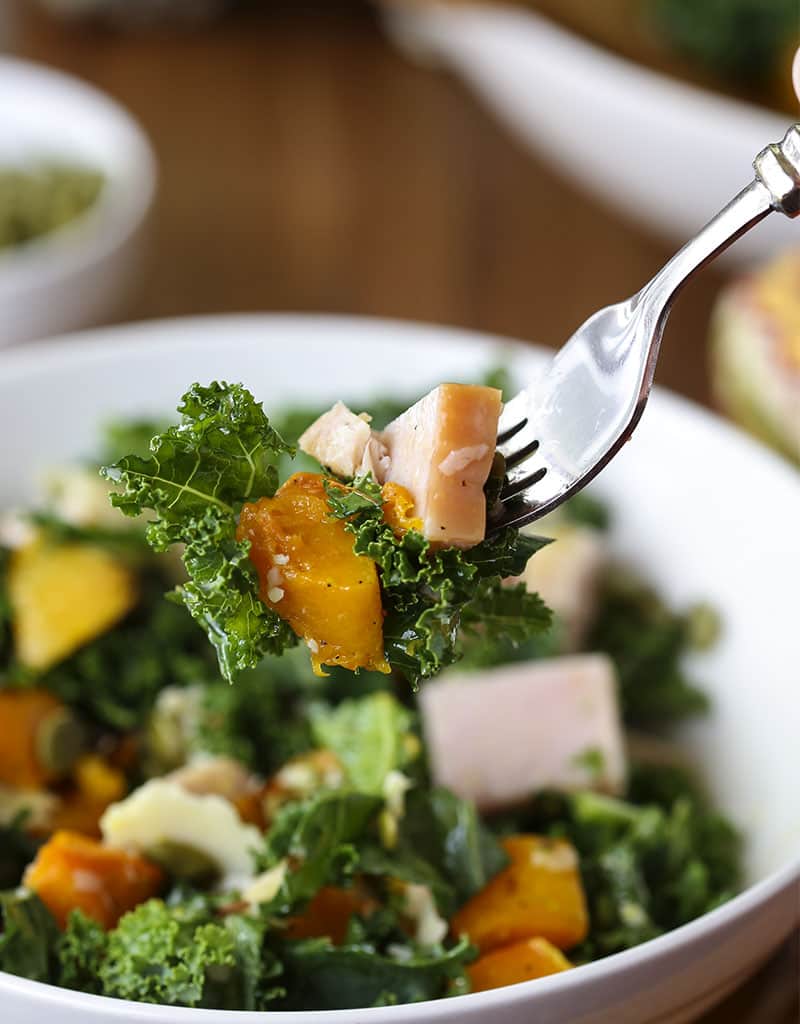 Salad on a fork, with autumn salad with butternut squash, turkey, and kale