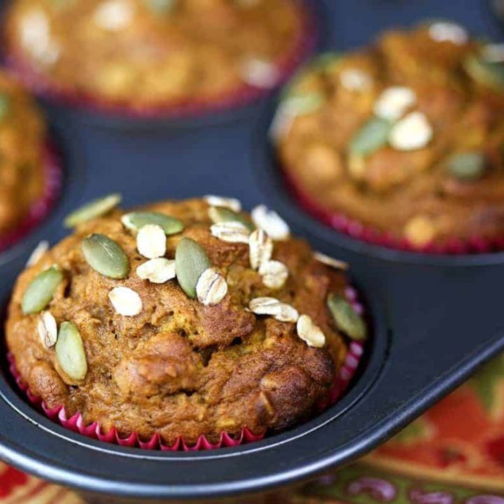 Pumpkin Oat Muffins in paper liners in a muffin pan