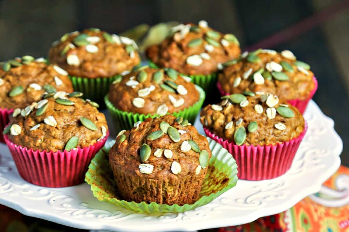 Pumpkin Oat Muffins in paper liners on a plate