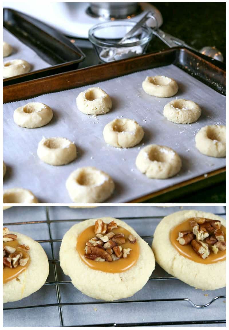 a baking sheet lined with parchment paper with unbaked cookie dough with thumb imprints