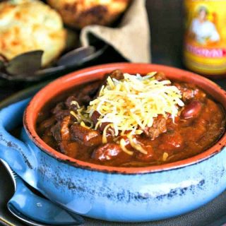 A bowl of  Slow Cooker Tex-Mex Chili topped with cheese