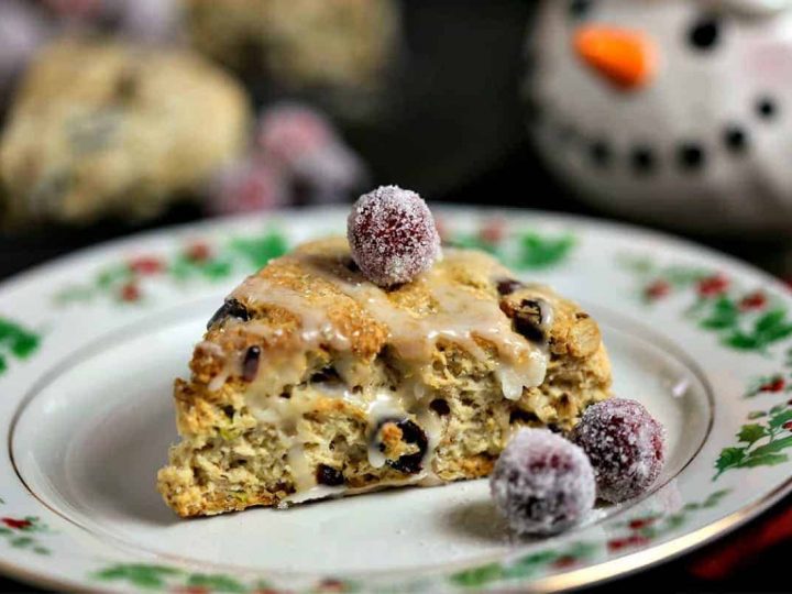 A close up of a cranberry pistachio scone on a plate