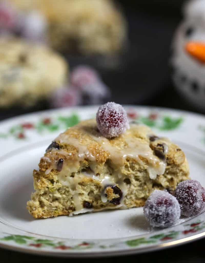 A close up of a cranberry pistachio scone on a plate