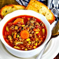 30-Minute Beefy Vegetable Soup in a white bowl with toasted bread
