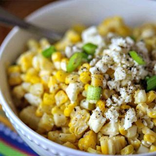 A bowl filled with corn, with Mexican Street Corn Salad