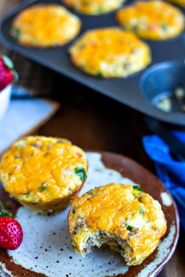 Gluten-Free Sausage Egg Muffin on a speckled plate with one bite out