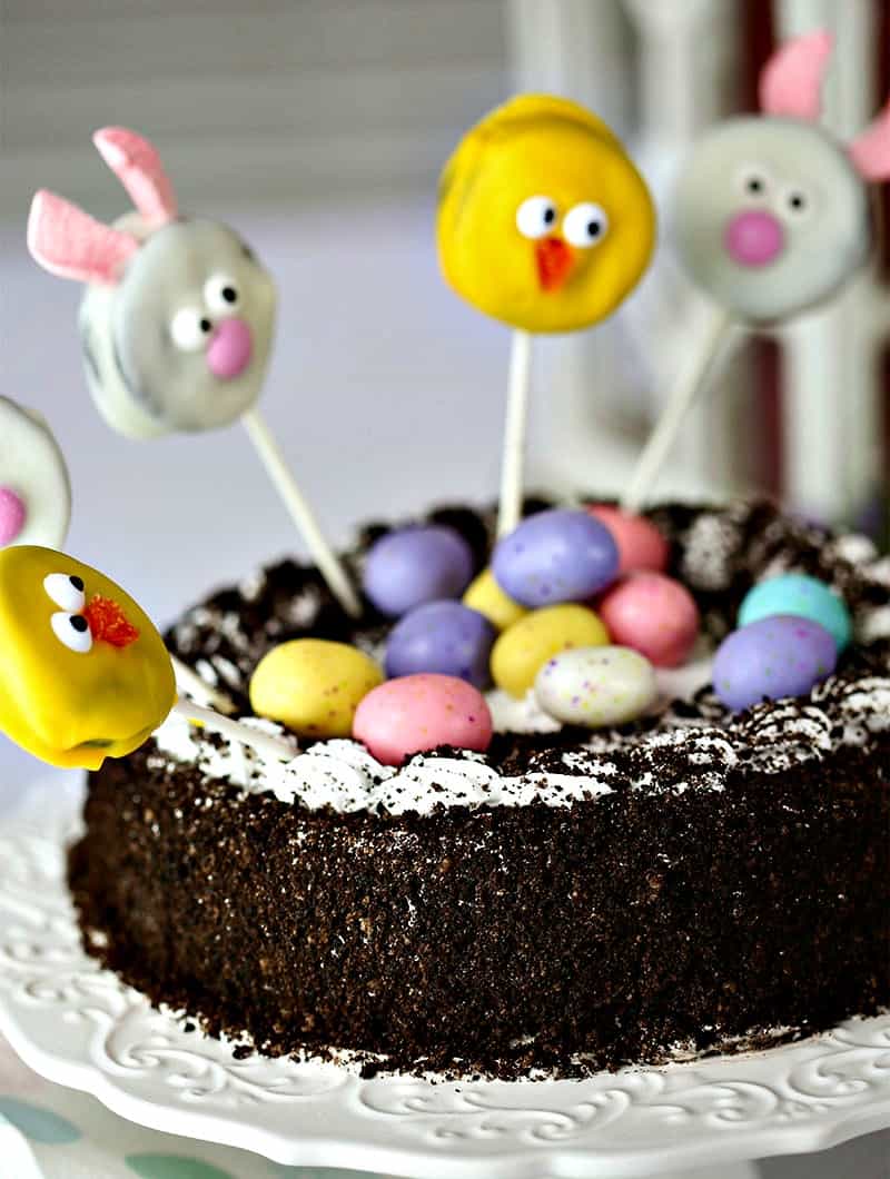 A close up of a chocolate ice cream cake decorated for Easter