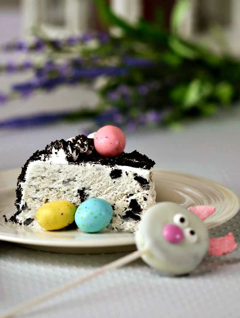 A close up of a slice of Oreo ice cream cake