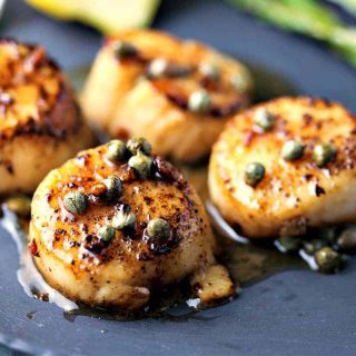 A plate of food, with Brown Butter Scallops