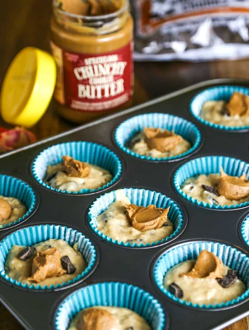 batter in paper cups in a muffin pan