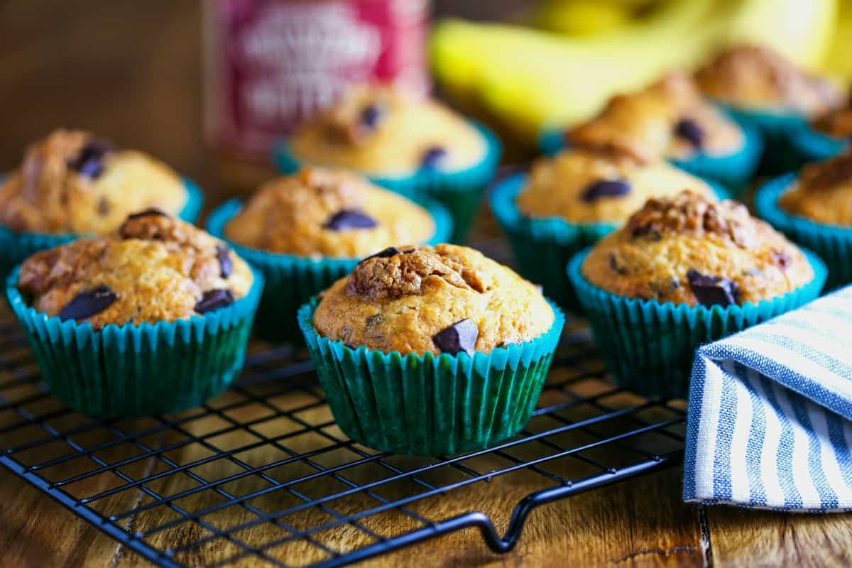 banana cookie butter muffins sitting on a wire rack