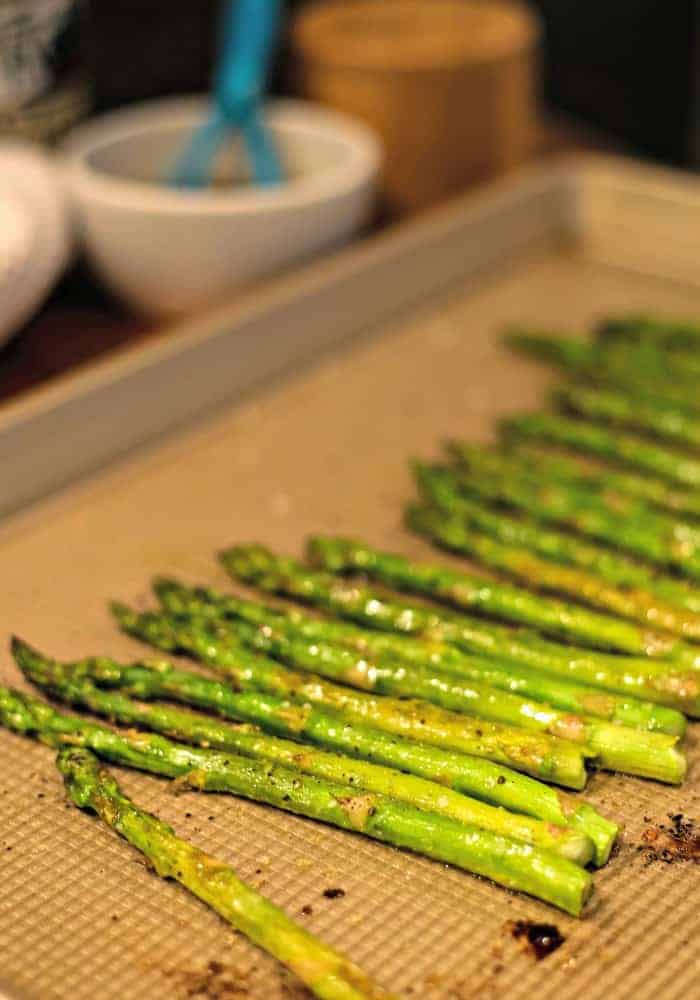 A baking sheet with asparagus