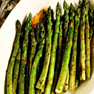 A plate of food, with asparagus