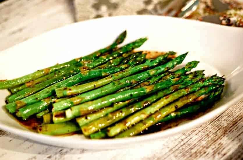 A plate of food with asparagus