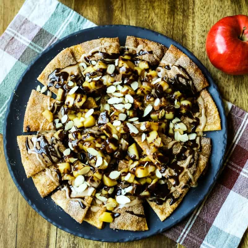 Apple Pie Nachos on a plate with chocolate ganache drizzled on top