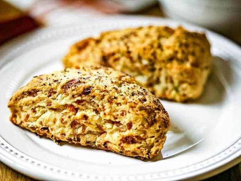 A plate of food on a table, with bacon scones