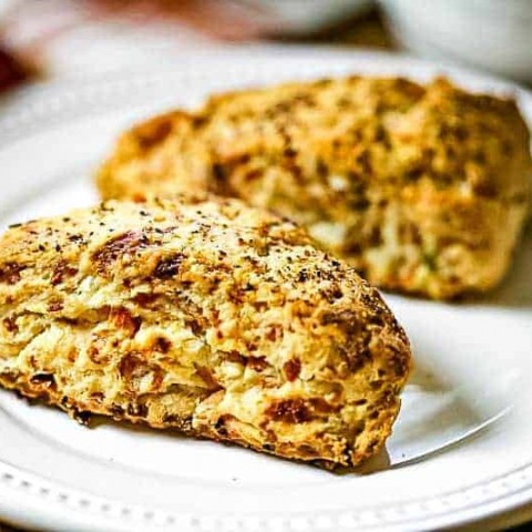 A plate of food on a table, with bacon scones
