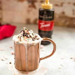 Dark chocolate peppermint mocha in a copper cup with whipped cream