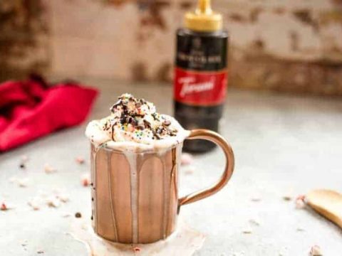 Dark chocolate peppermint mocha in a copper cup with whipped cream