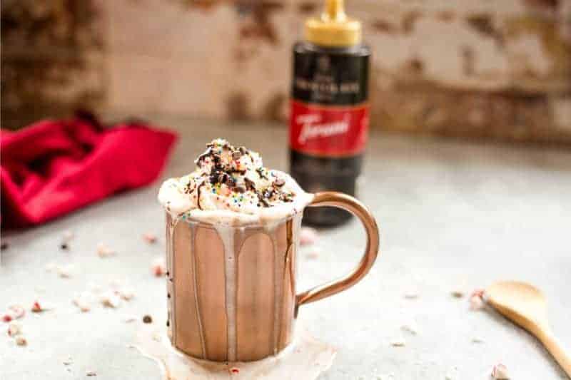 Dark chocolate peppermint mocha in a copper cup with whipped cream