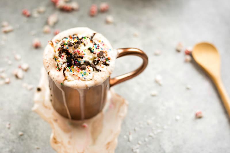 Dark chocolate peppermint mocha in a copper cup with whipped cream