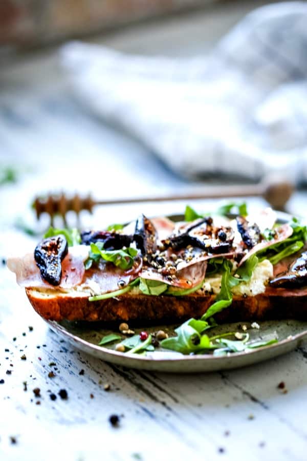 A plate of food on a table, with Ricotta and Toast
