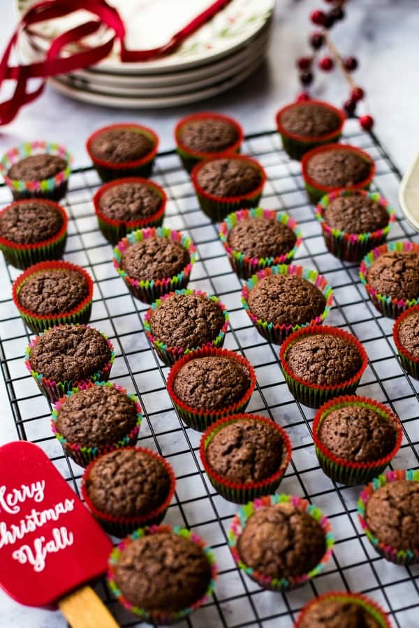 A bunch of bite-size brownies in paper cups