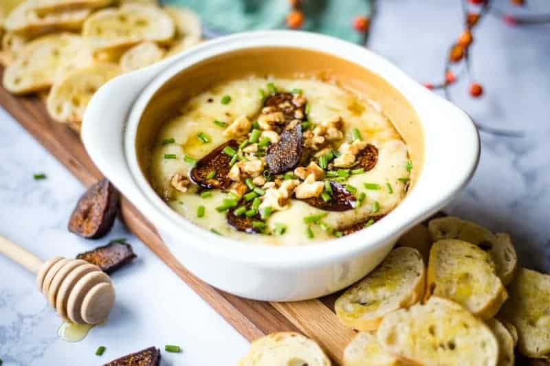 Baked Brie and Fig Spread on tray with toasted baguette