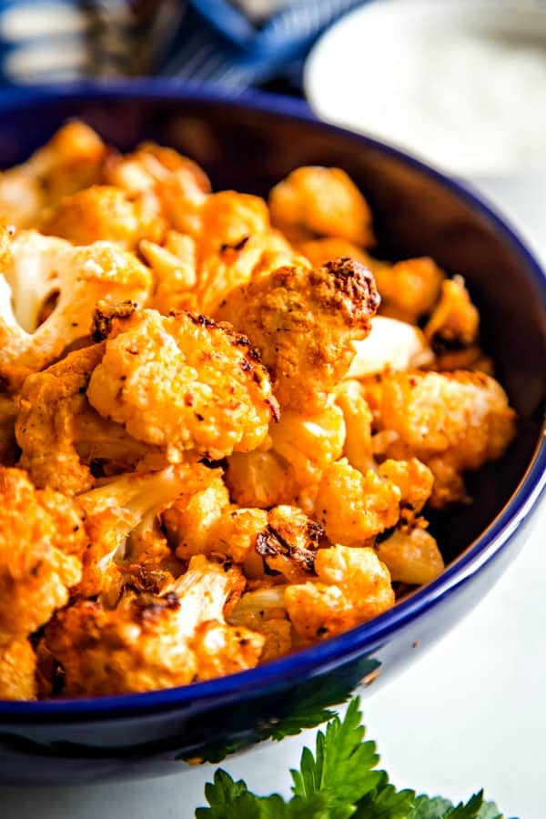 Roasted Buffalo Cauliflower in blue bowl