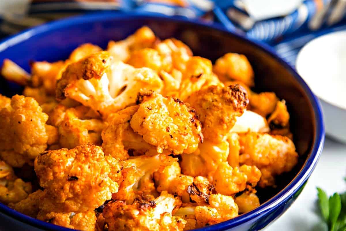 Roasted Buffalo Cauliflower in blue bowl