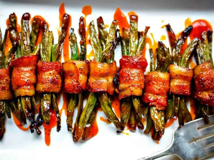 Bacon Wrapped Green Bean Bundles on white serving tray
